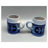 MCM Pair of Blue Stoneware Beer Steins with Relief Design