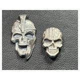 Two Skull-Shaped Silver Pieces