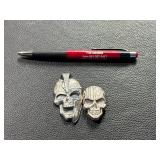 Two Skull-Shaped Silver Pieces