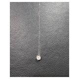 Â Necklace with Circular Pendant and Patterned Design