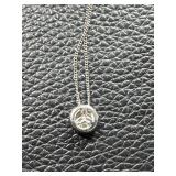 Â Necklace with Circular Pendant and Patterned Design