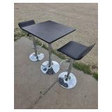 Bar height table and 2 matching rotating bar stools