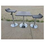 Bar height table and 2 matching rotating bar stools