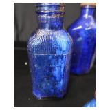 18 COBALT BLUE GLASS BOTTLES 18 COBALT BLUE GLASS BOTTLES