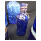 18 COBALT BLUE GLASS BOTTLES 18 COBALT BLUE GLASS BOTTLES