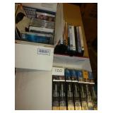 group of dvds, cds, vhs
