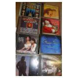 group of dvds, cds, vhs