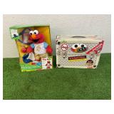 Check-Up Time Elmo & T.M.X. Tickle Me Elmo Check-Up Time Elmo & T.M.X. Tickle Me Elmo