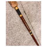 Vintage Fishing Rod with Red Baitcasting Reel and Cork Handle