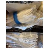 Collection of Disposable Tableware including Plates, Cups, Utensils, and Napkins