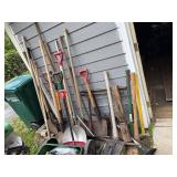 Collection of Garden and Yard Tools including Shovels, Rakes, and Hoes