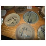 Collection of 13 Handmade Pottery Plates with Artistic Designs