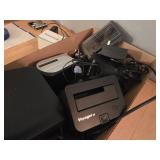 Box of External Hard Drive Docks, DVD Drive, and Accessories