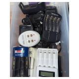 Collection of Remote Controls and Battery Chargers with Charging Docks