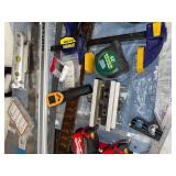 Collection of Measuring Tools, Clamps, and Hand Tools Including Tape Measures and Squares