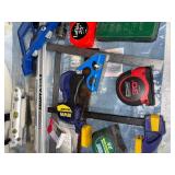 Collection of Measuring Tools, Clamps, and Hand Tools Including Tape Measures and Squares