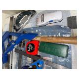 Collection of Measuring Tools, Clamps, and Hand Tools Including Tape Measures and Squares