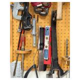 Workshop Hand Tool Collection with Levels, Pipe Wrenches, and Squares