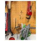 Workshop Hand Tool Collection with Levels, Pipe Wrenches, and Squares