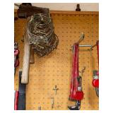 Workshop Hand Tool Collection with Levels, Pipe Wrenches, and Squares