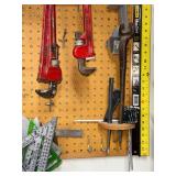 Workshop Hand Tool Collection with Levels, Pipe Wrenches, and Squares