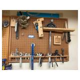 Assorted Hand Tools and Wrenches Hanging on Pegboard