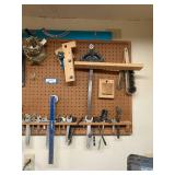 Assorted Hand Tools and Wrenches Hanging on Pegboard