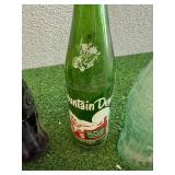 Mixed Collectibles - Bobcat Clock, Soda Bottles, Velvet Tin