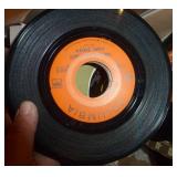 Box full of 45 rpm records Box full of 45 rpm records