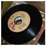 Box full of 45 rpm records Box full of 45 rpm records