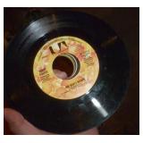 Box full of 45 rpm records must be close to 100 Box full of 45 rpm records must be close to 100
