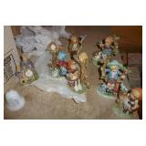 Hummel style figurines and a clock Hummel style figurines and a clock