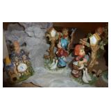 Hummel style figurines and a clock Hummel style figurines and a clock