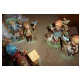 Hummel style figurines and a clock Hummel style figurines and a clock