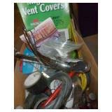 Box with a faucet, hose, tape, electrical cord, vent covers, duct tape, hammer Box with a faucet, hose, tape, electrical cord, vent covers, duct tape, hammer