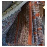 Group of throw rugs Group of throw rugs
