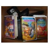 Box of VHS including Disney and some 8 track tapes Box of VHS including Disney and some 8 track tapes