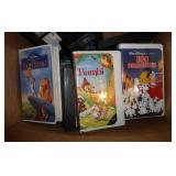 Box of VHS including Disney and some 8 track tapes Box of VHS including Disney and some 8 track tapes