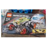 New wireless headphones, New Lego racers, plush bear, train wall hangings, thomas train, doll clothes and a heart light New wireless headphones, New Lego racers, plush bear, train wall hangings, thomas train, doll clothes and a heart light