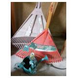 Wall of rakes, brooms, shovel, flag Wall of rakes, brooms, shovel, flag