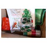 Box of christmas towels, hot pads, ribbon, cookie trays, tree bag, bell, candle holder, snowman Box of christmas towels, hot pads, ribbon, cookie trays, tree bag, bell, candle holder, snowman