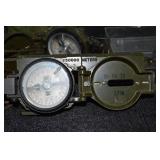 VINTAGE MILITARY COMPASSES AND MEDAL.