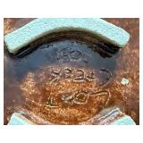 Decorative Basket and Pottery Collection Including Woven Vessels, Painted Plate, and Faux Floral Arrangement