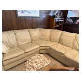 Beige Leather Sectional Sofa with Wear on Armrest