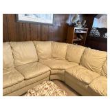Beige Leather Sectional Sofa with Wear on Armrest