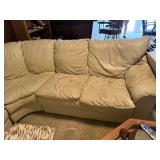 Beige Leather Sectional Sofa with Wear on Armrest