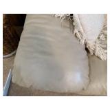 Beige Leather Sectional Sofa with Wear on Armrest