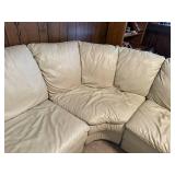 Beige Leather Sectional Sofa with Wear on Armrest