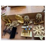 Group assorted brass stocking holders, etc.