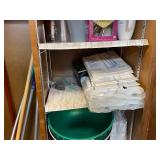 Kitchen Cabinet Contents with Bowls, Cups, Pots, Cleaning Tools and Supplies